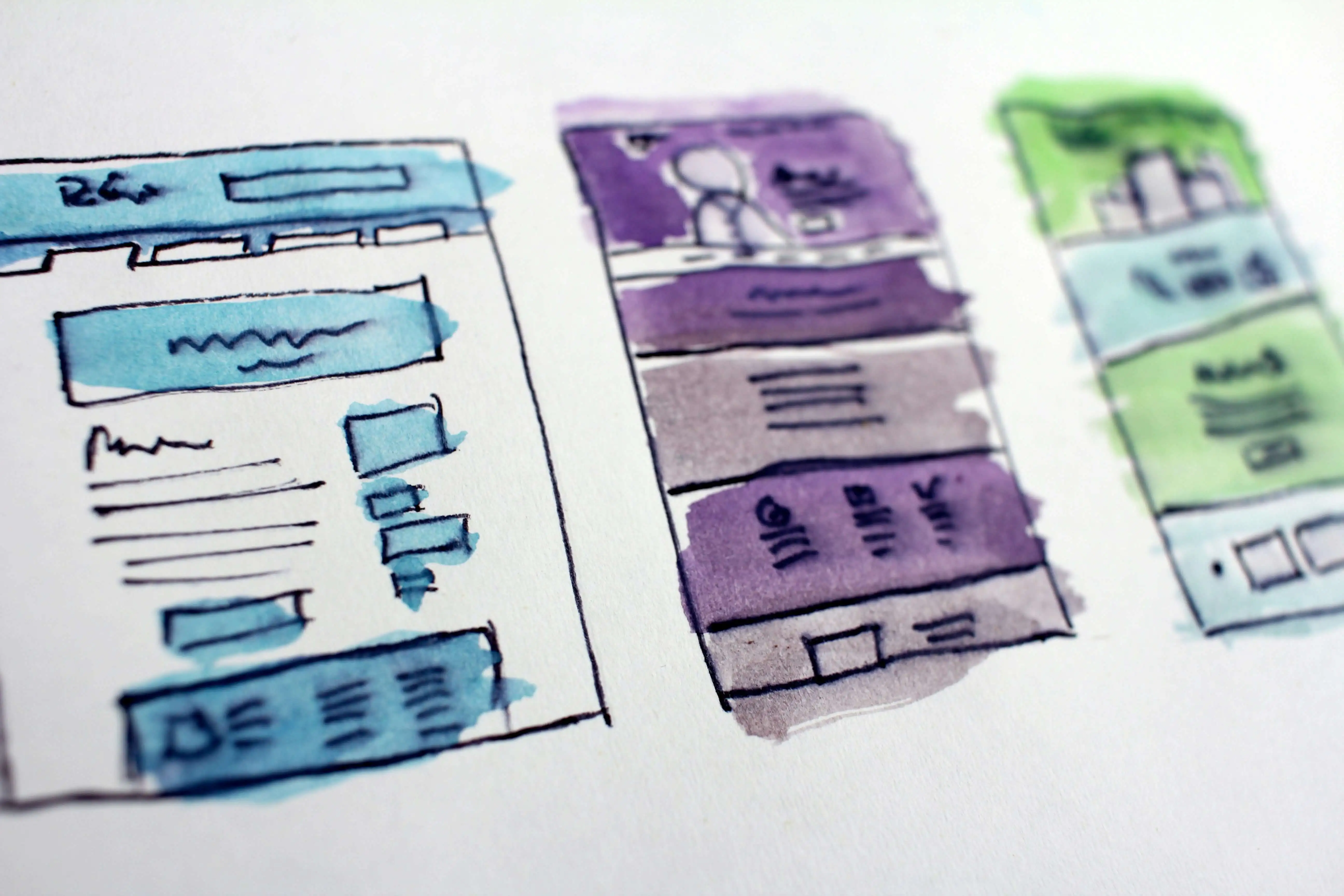 Sketches of website layouts on paper